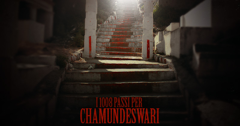 scalinata di granito in penombra con la scritta rossa I 1008 passi per Chamundeshwari